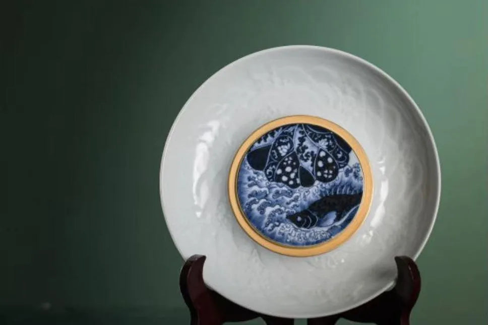 Deep cobalt blue diffusing across white porcelain