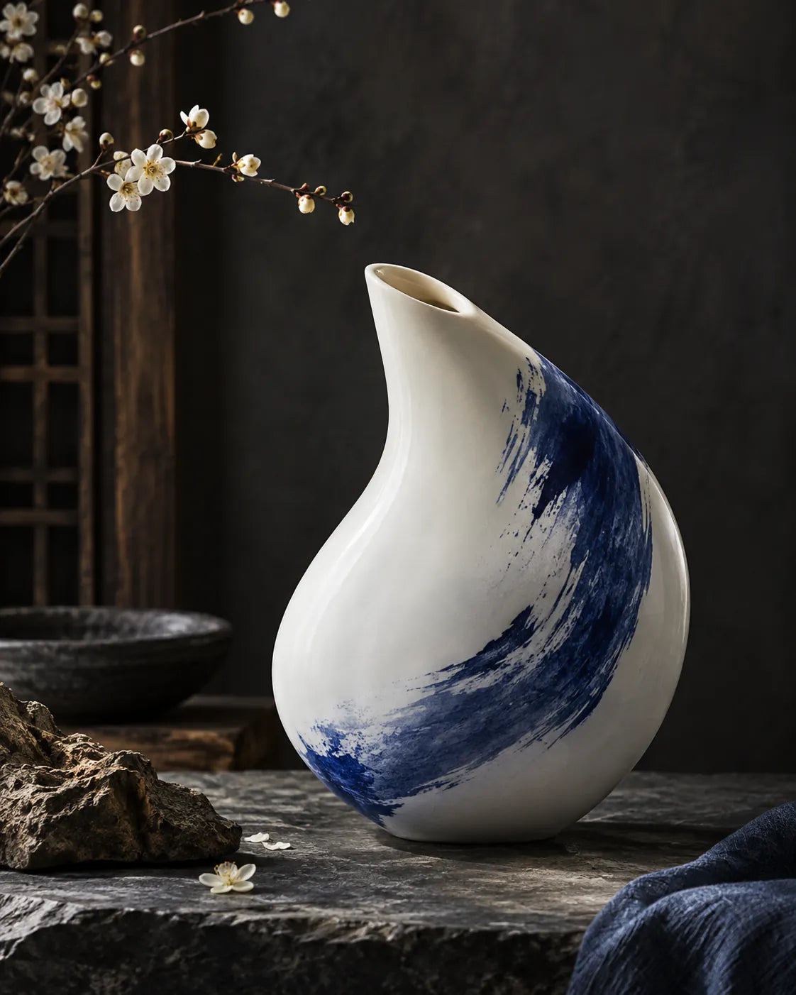 Asymmetrical white porcelain vessel with an offset opening and blue brushstroke.